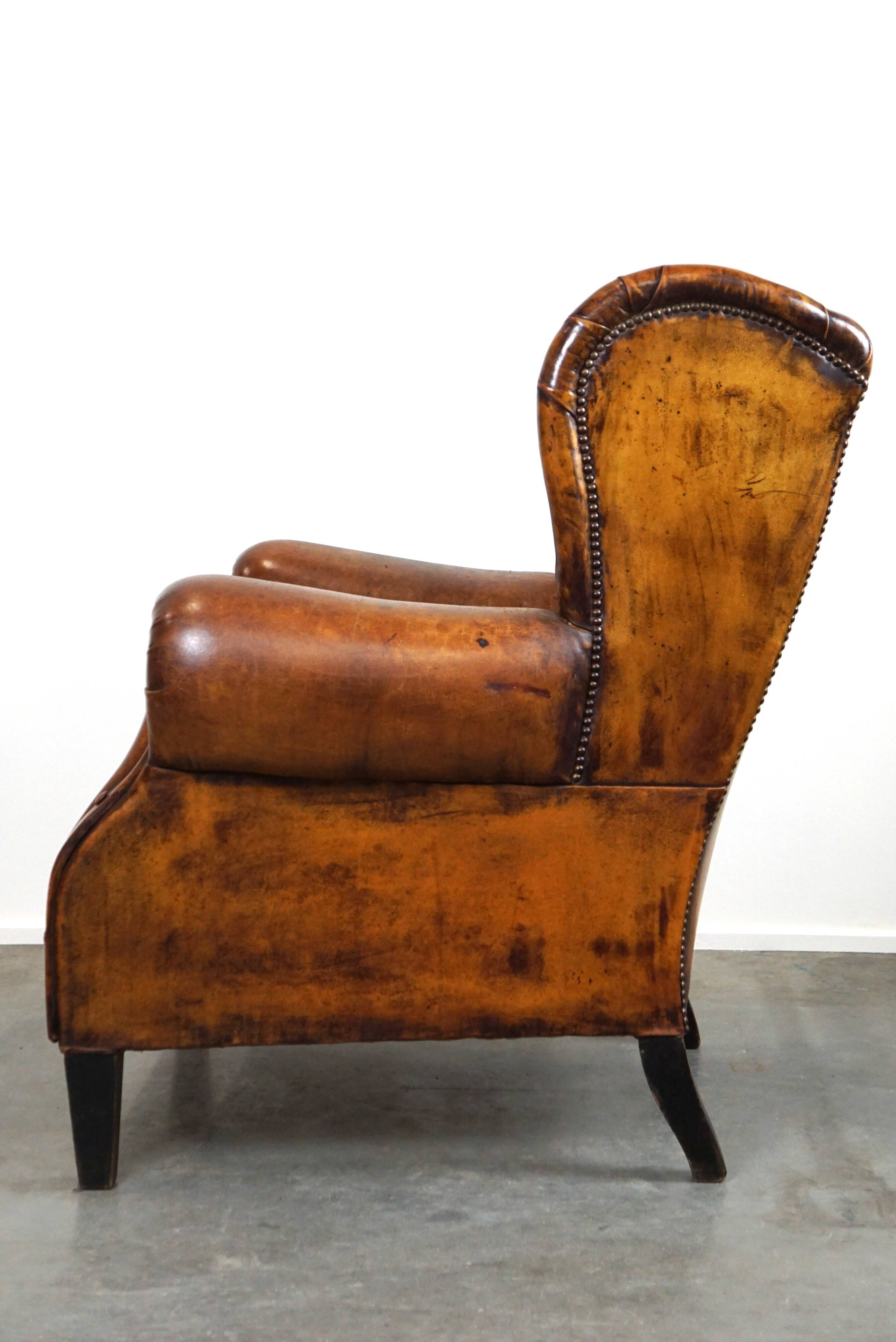 Irresistible old sheep leather wingback armchair with the most beautiful colors