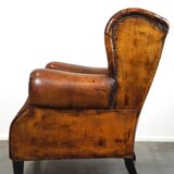 Irresistible old sheep leather wingback armchair with the most beautiful colors
