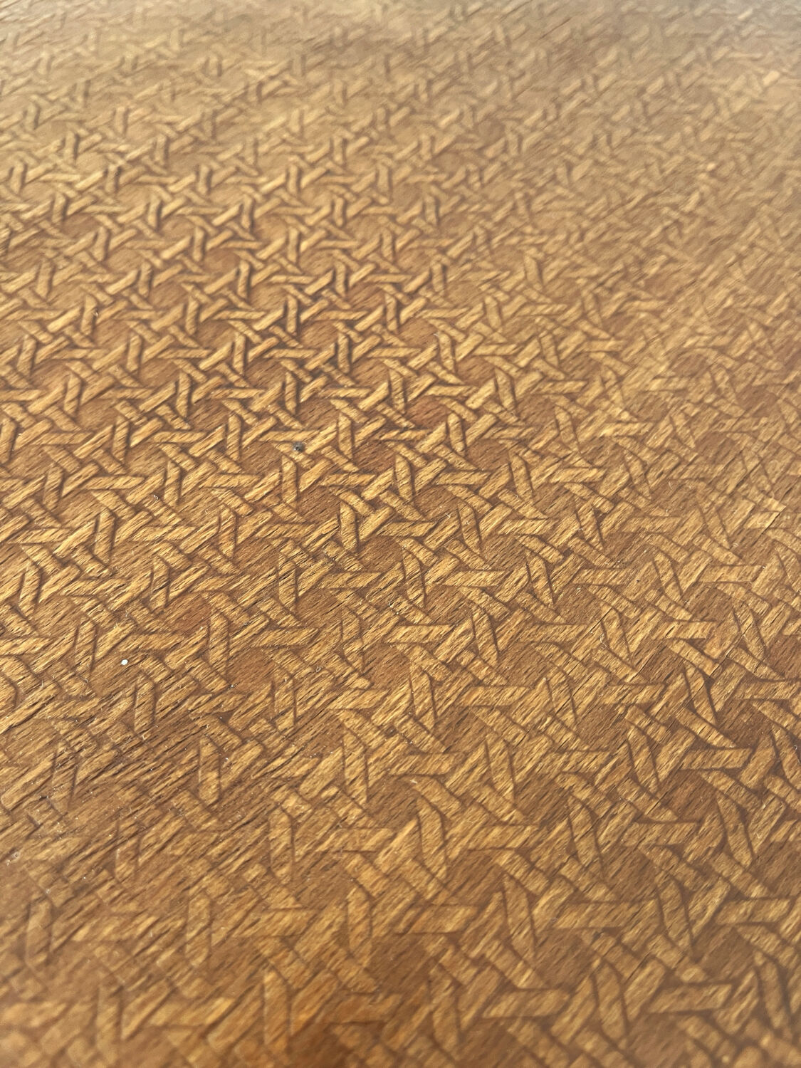 2 antique bistro stools with curved wood and caning effect.