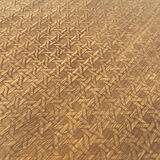 2 antique bistro stools with curved wood and caning effect.