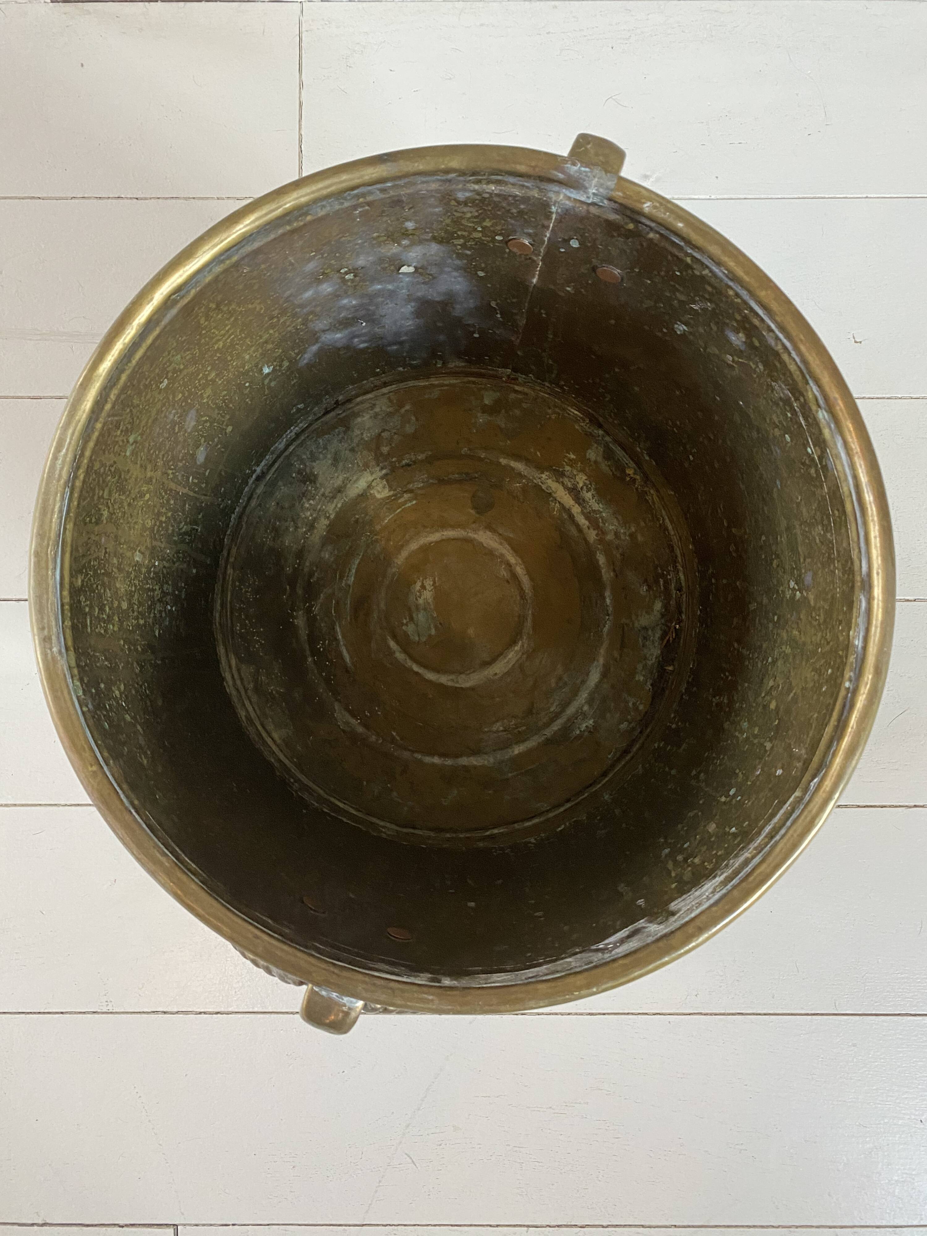 Engraved brass pot cover