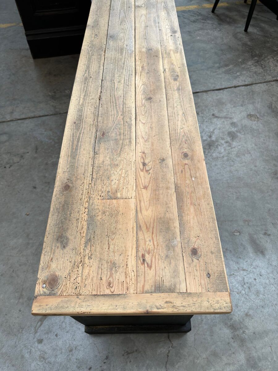 Old workshop furniture transformed into a TV unit.