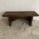 Old low stool made of solid wood