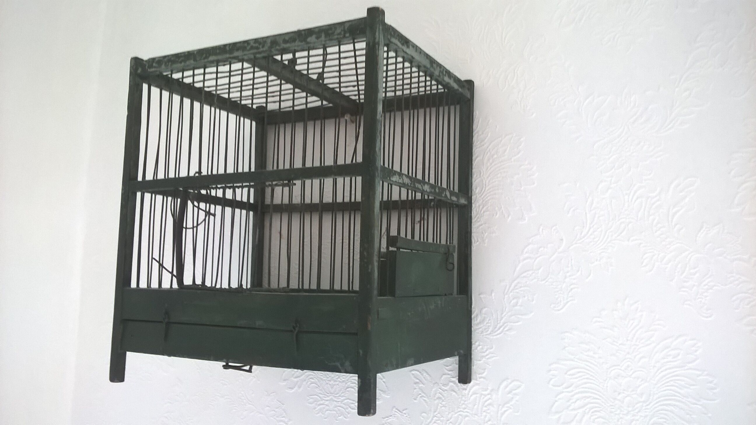 Wooden bird cage with feeder