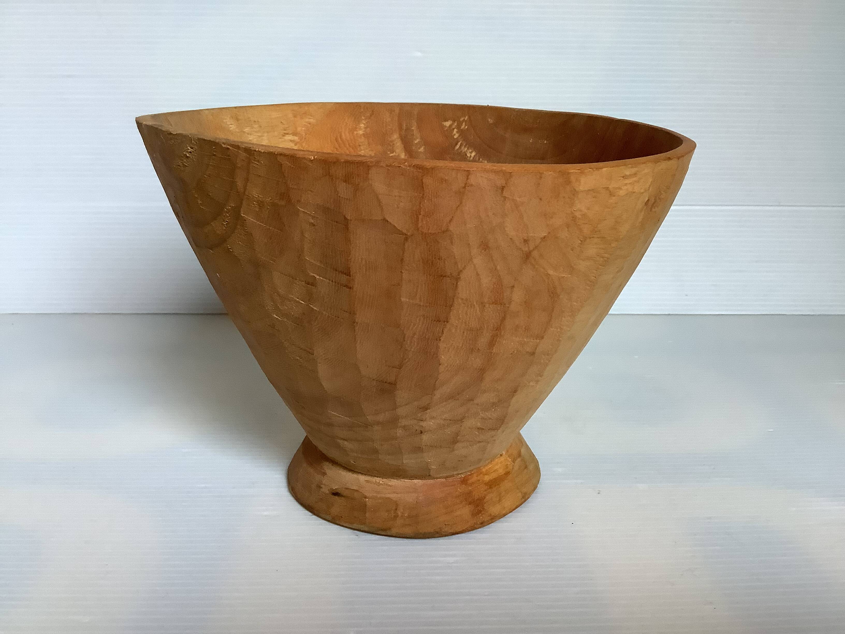 Asymmetrical wooden sculpted catchall.
