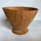 Asymmetrical wooden sculpted catchall.