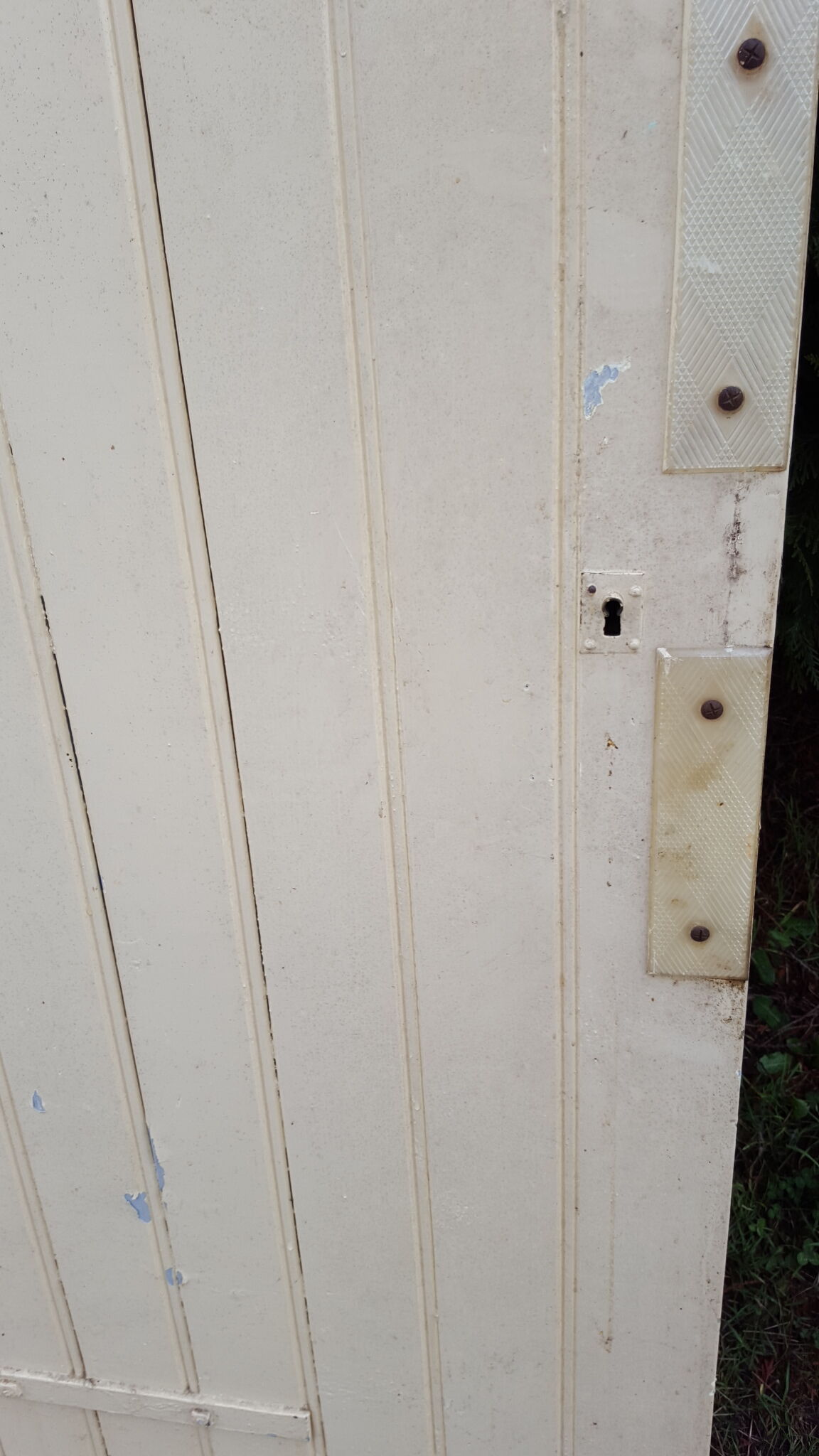 Old door in cream lacquered wood