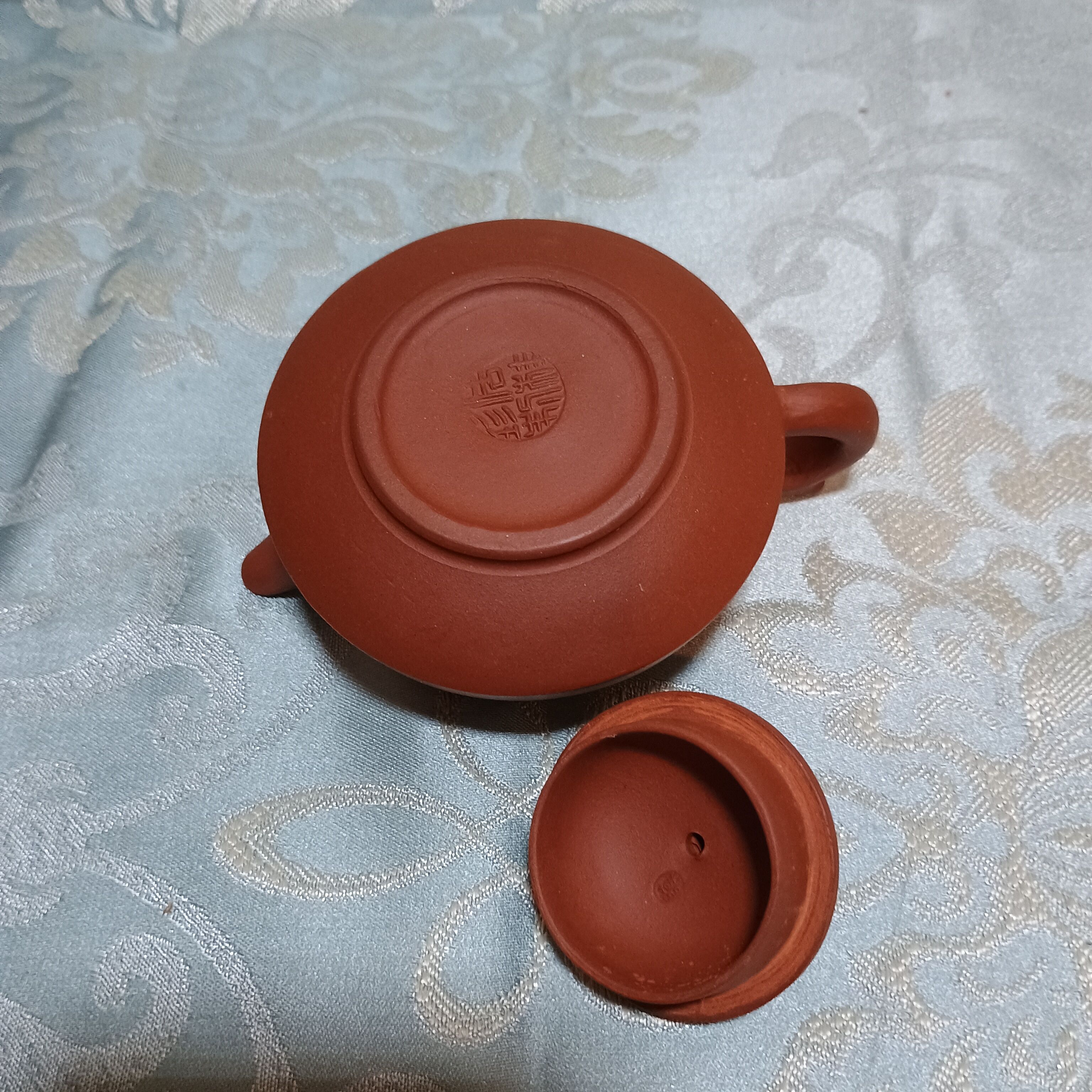 Yixing teapot in signed red clay