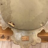 Bakelite scrolled mirror with rocaille pediment