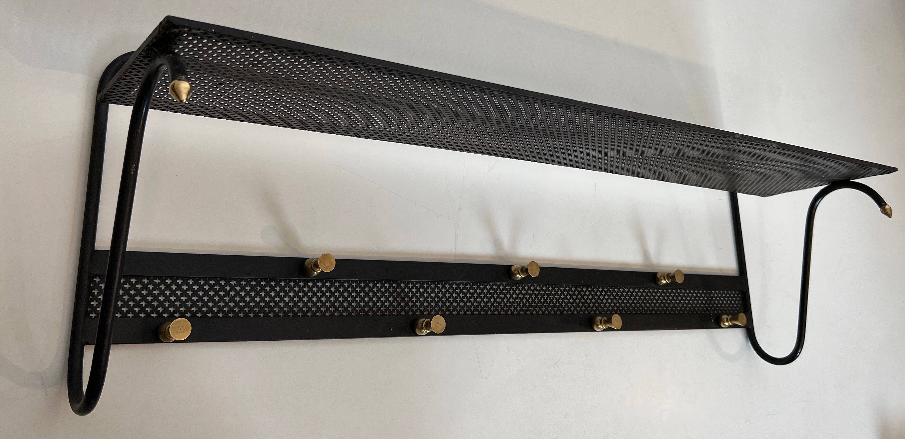 Coat rack in black lacquered metal, perforated sheet metal and brass in the style of Mathieu Matégot