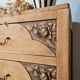 Art Deco chest of drawers in raw oak with carved drawers.