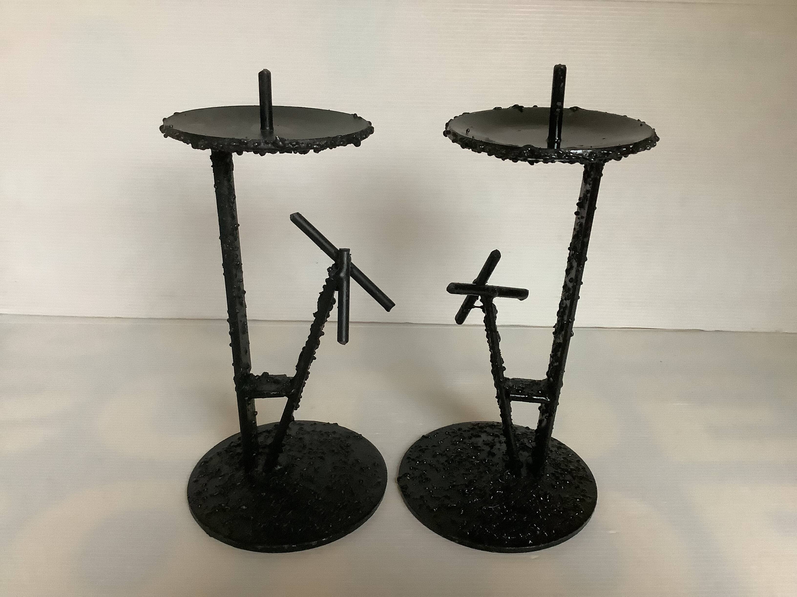 Pair of black metal candlesticks