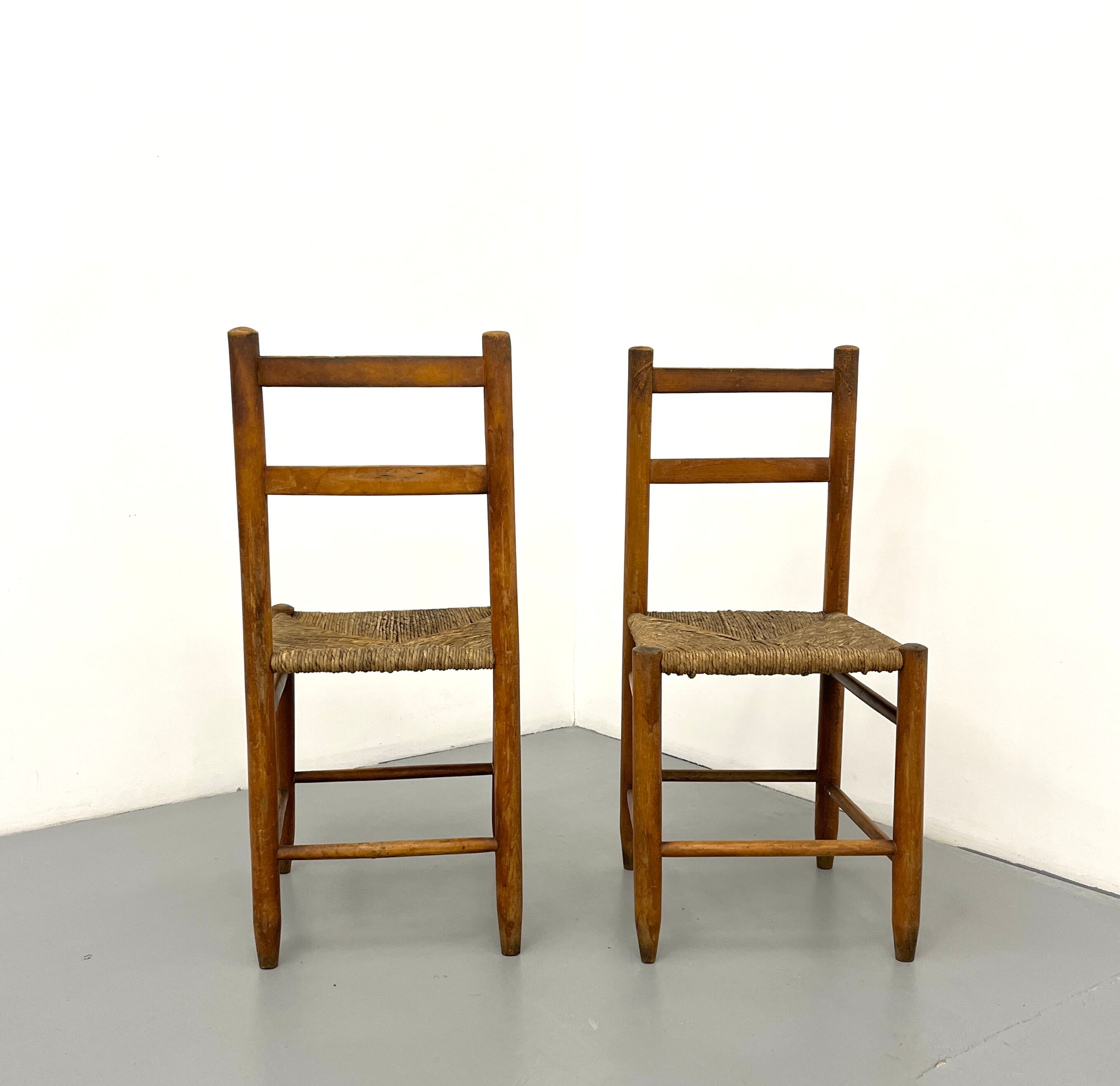 Pair of vintage wooden chairs with mulched seat