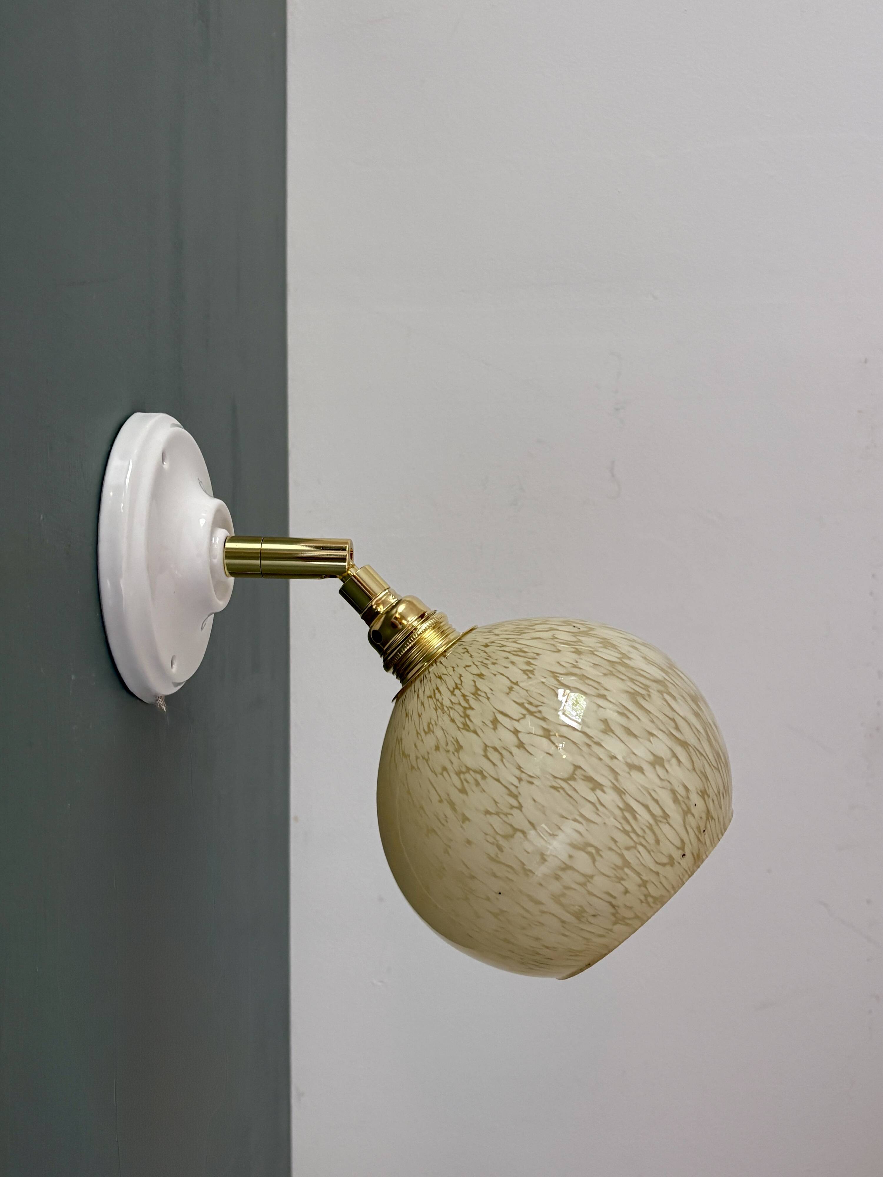 Vintage glass globe wall light in pale yellow from Clichy.