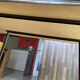 TV stand on casters, 2 brown Formica shelves, 1960s
