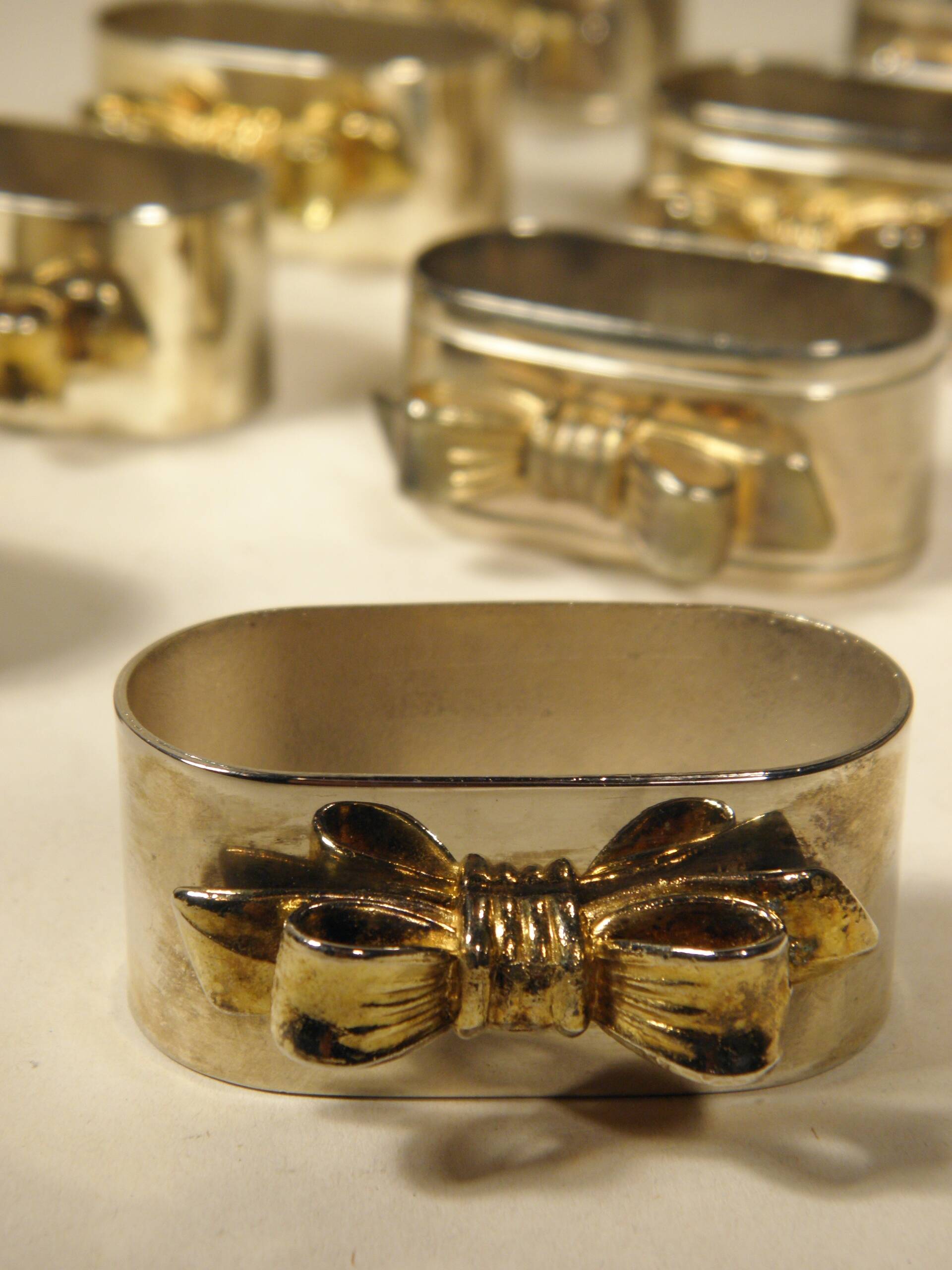 8 silver and gold napkin rings
