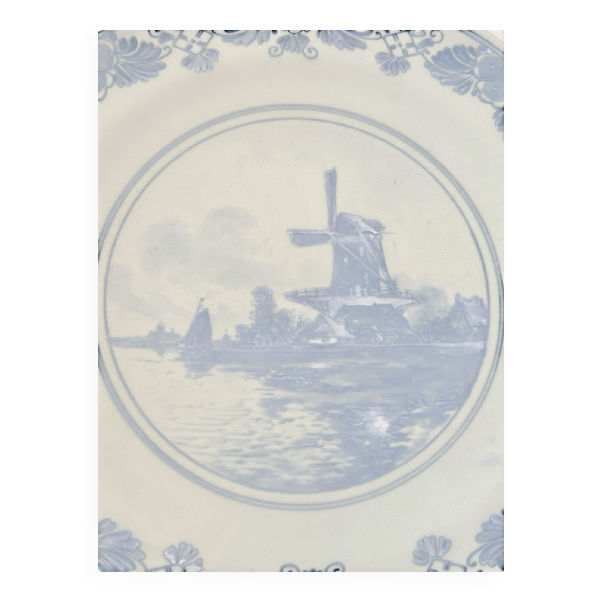 Old wall plate in blue Delft pottery