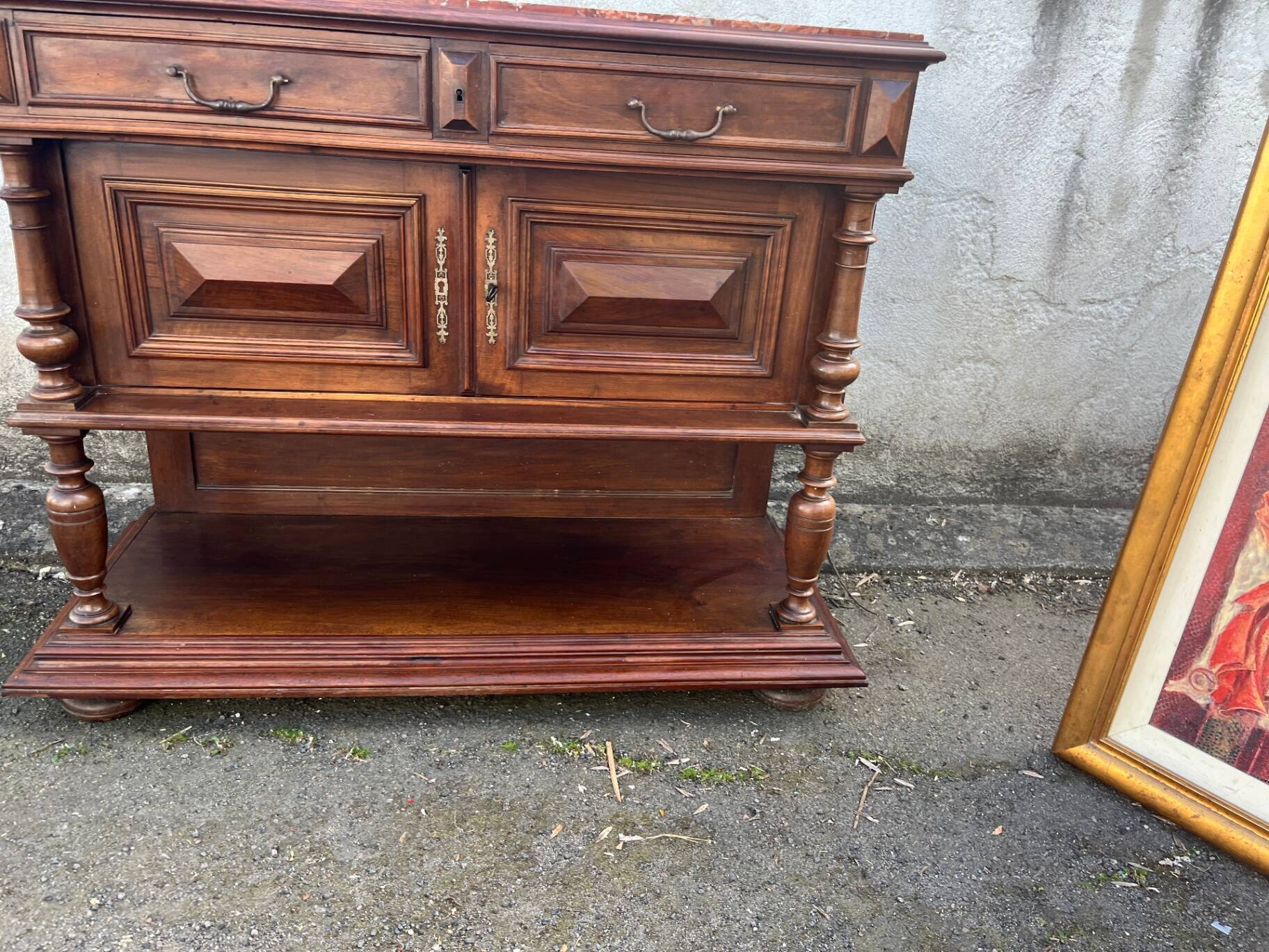 Henri II style console table with a red marble top.