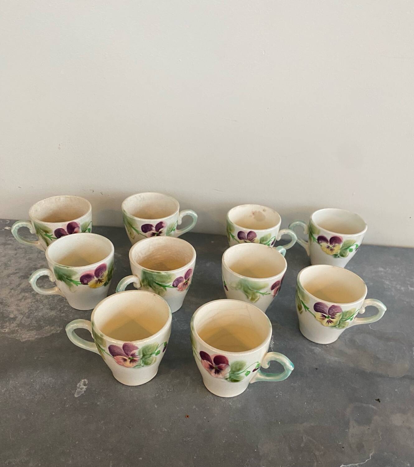 10 slipware cups, pansies