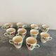 10 slipware cups, pansies