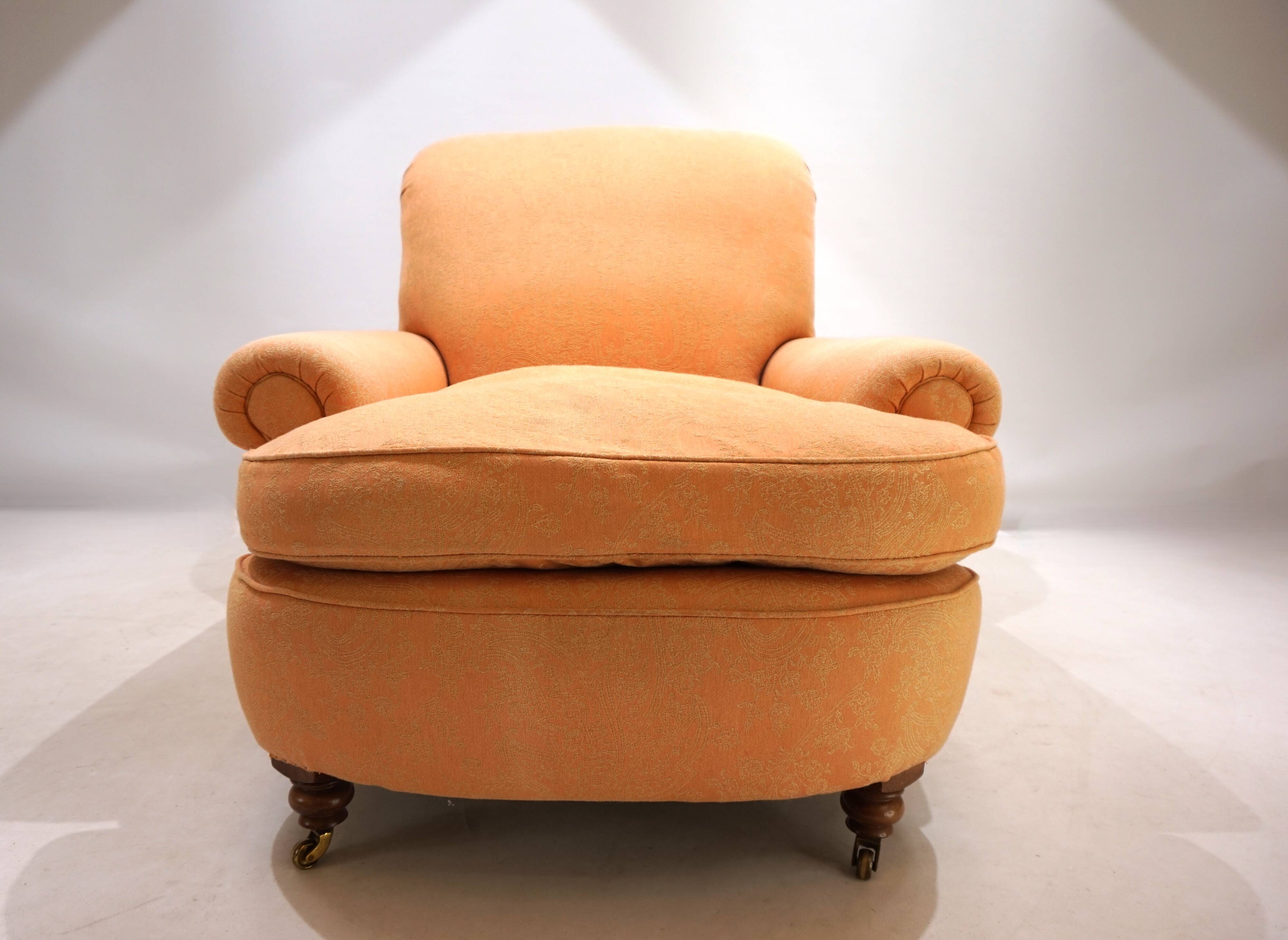 Deep seated armchair in the style of Howard & Sons