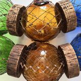 Fishing floats made of blown glass, cork, and rope. France, 1960s.