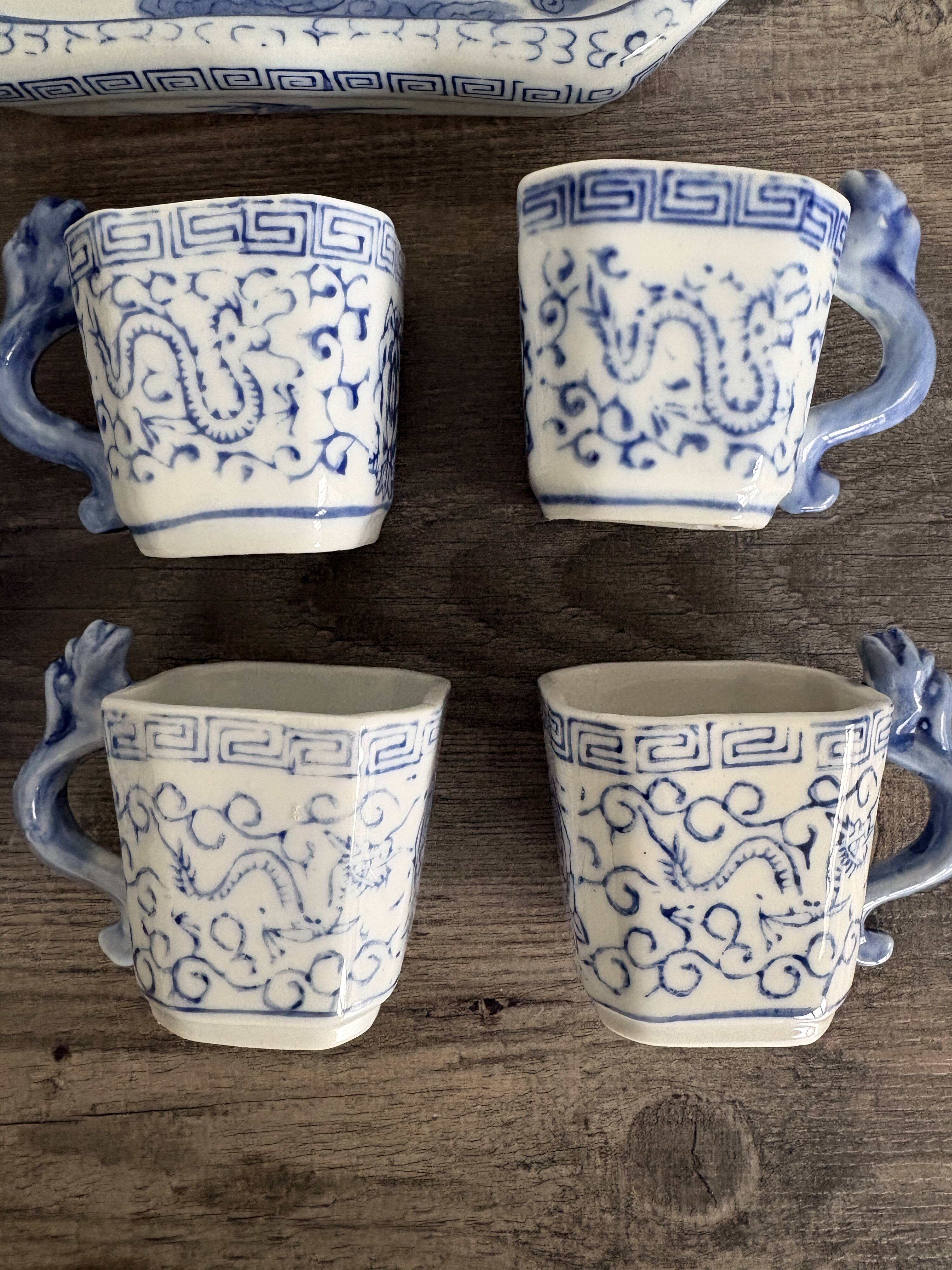 Antique Chinese tea set decorated with dragons.