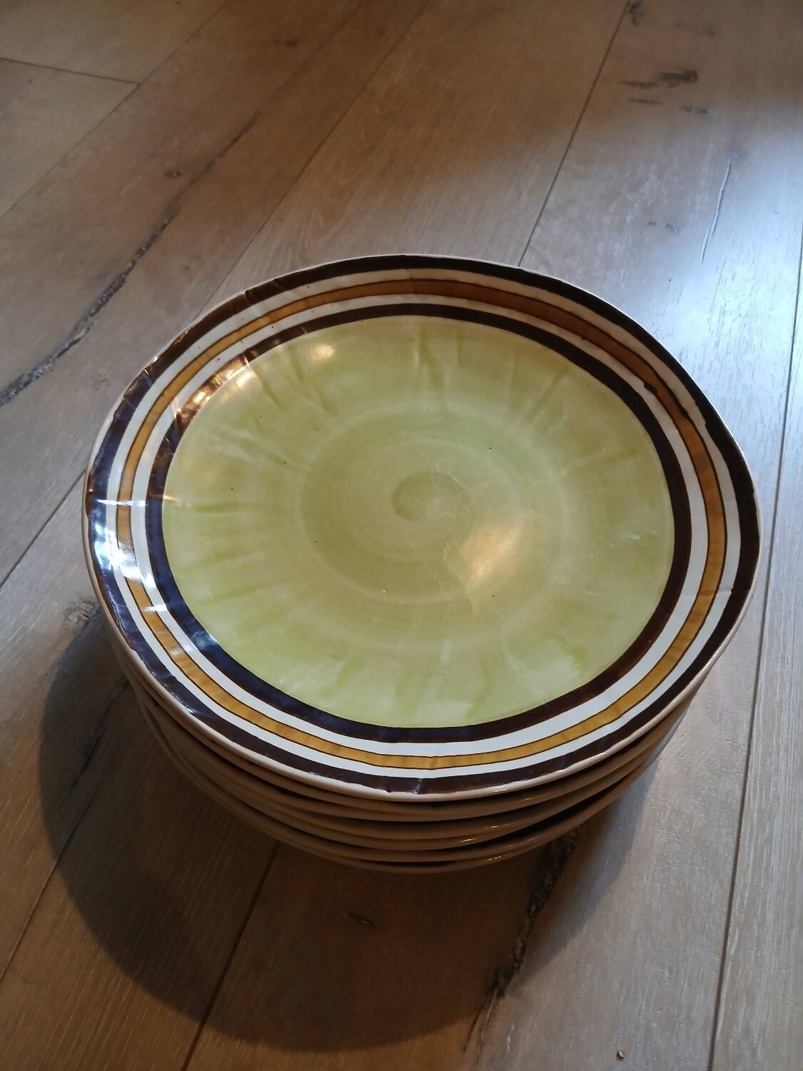 7 old stoneware flat plates