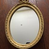 Oval wall mirror in baroque gilded plaster frame 29x20cm