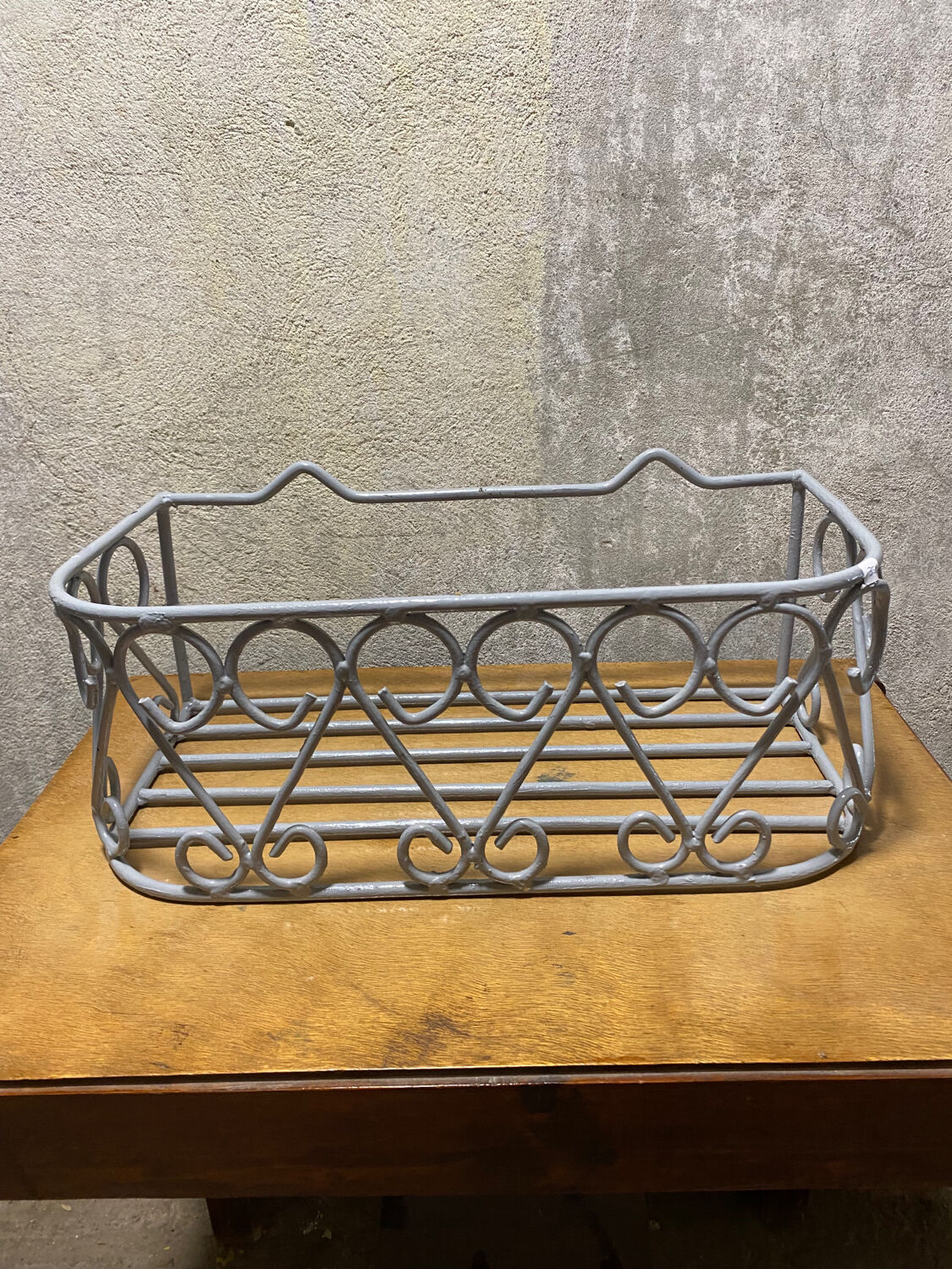 Gray wrought iron shelf