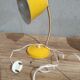 Yellow articulated desk lamp in metal