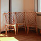 Trio of chairs in rattan Louis Sognot 50 60
