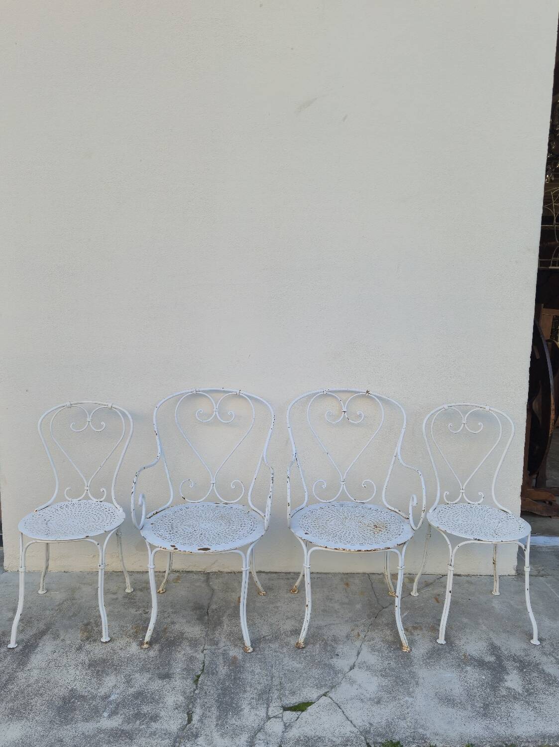 Garden furniture, two armchairs and two wrought iron chairs, period 1