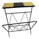 Black metal magazine rack and yellow and black tiled shelf.