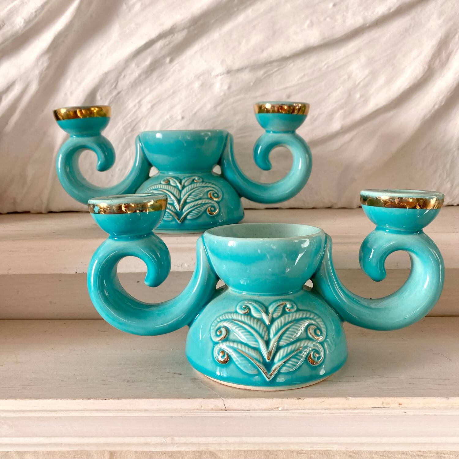 Pair of turquoise and gold double candlesticks