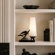 Art Deco lamp with swallow sculpture, marble base, opaque white globe.