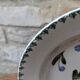 Old deep iron earth plate with blue flower pattern