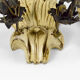 Pair of Hollywood Regency sconces in carved, painted and patinated wood, 1950s