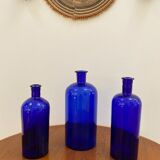 Trio of apothecary bottles in cobalt blue glass