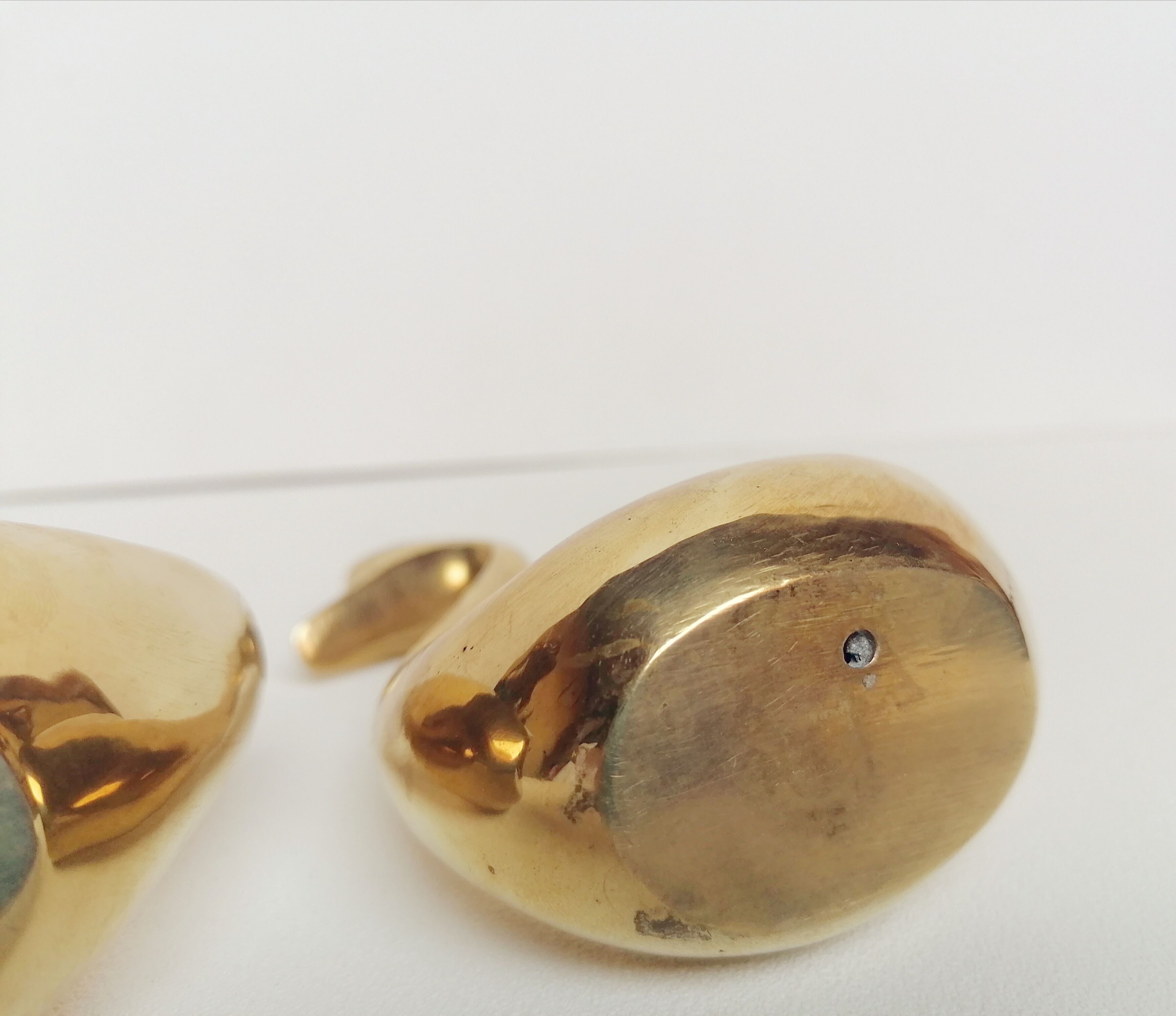 Two ducks made of solid brass