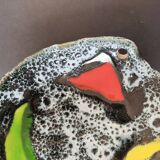 Empty black and white pocket with colored enamels