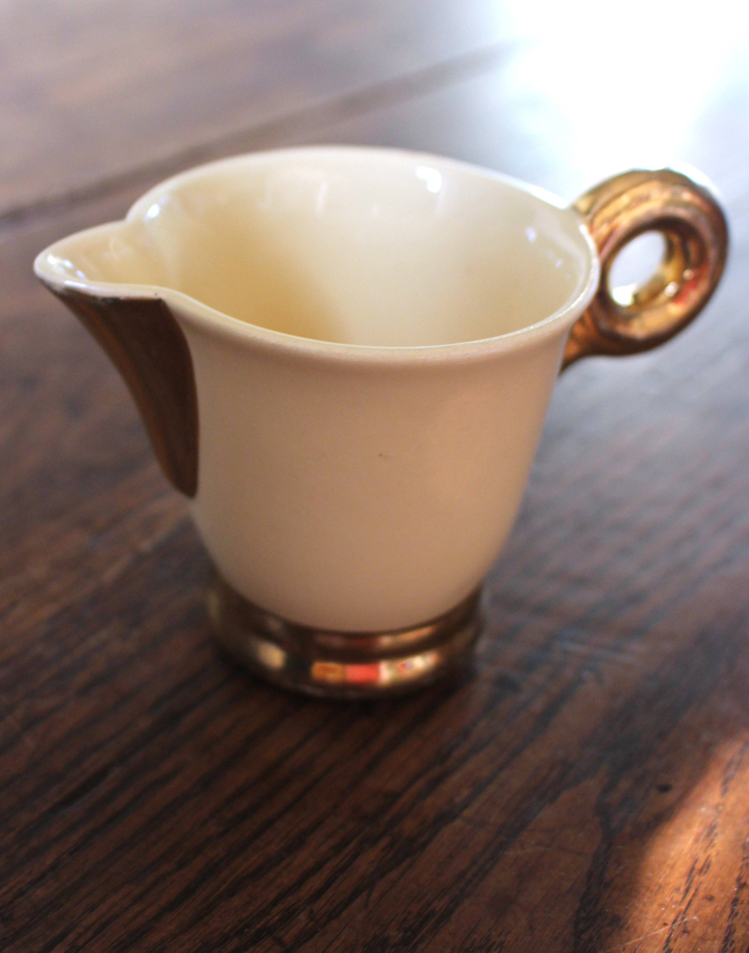 Ecru ceramic milk jug with gold decoration from Sarreguemines.