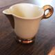 Ecru ceramic milk jug with gold decoration from Sarreguemines.