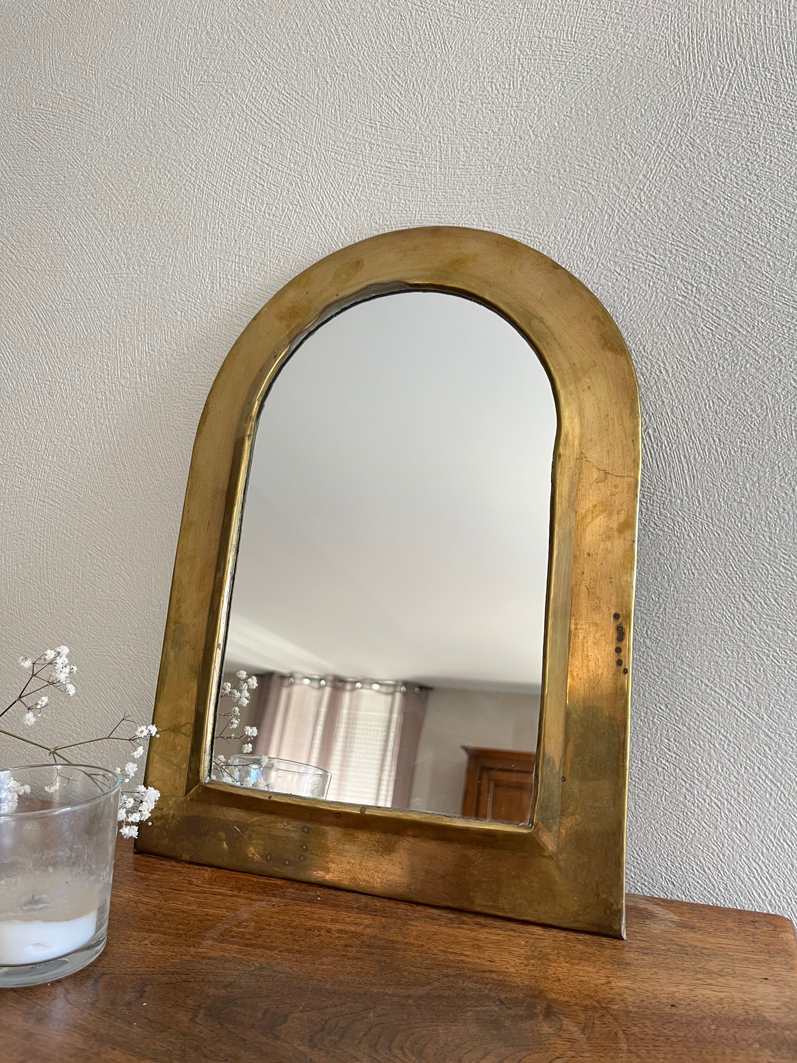 Brass half-moon mirror