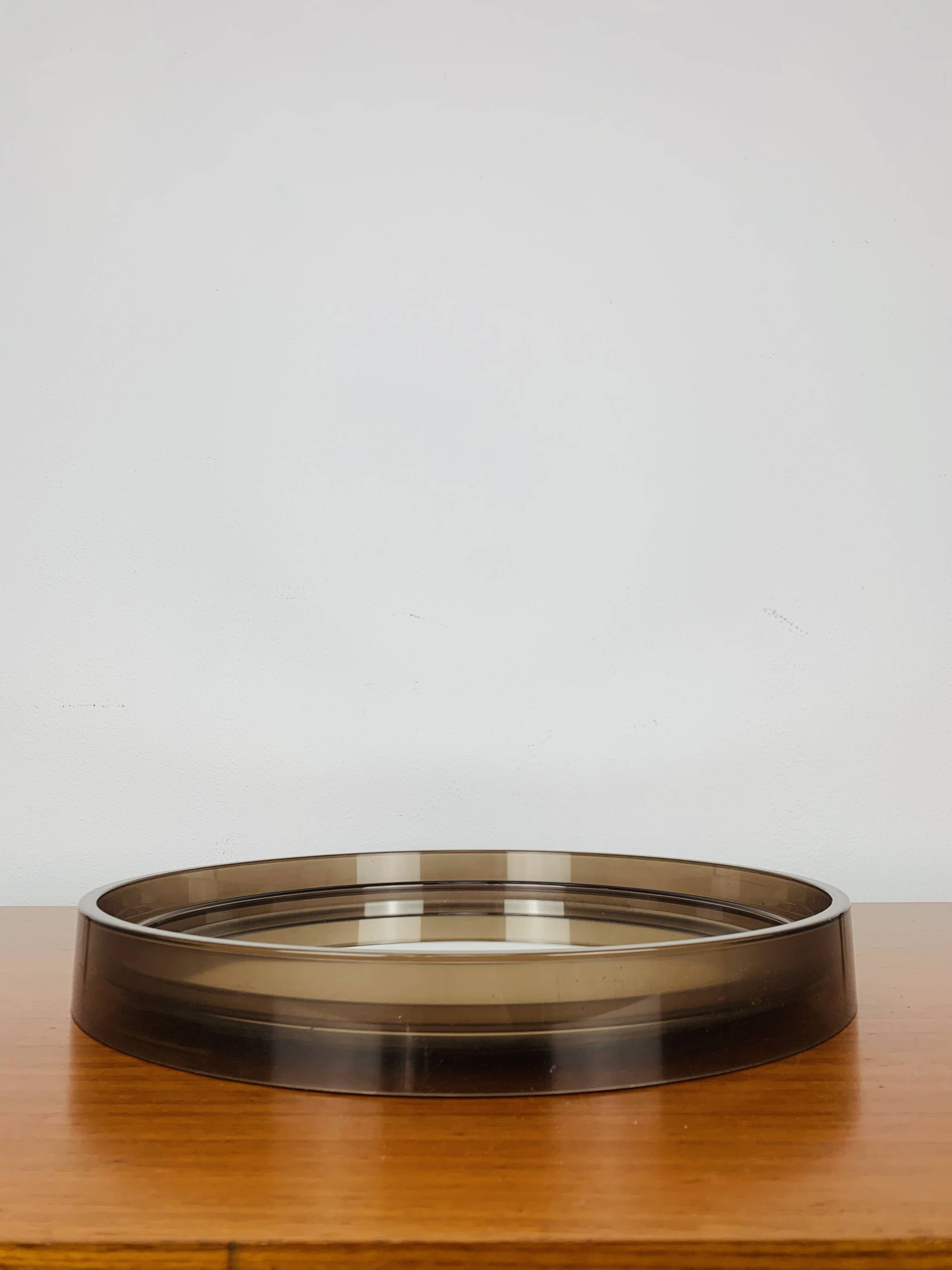 Round mirror with amber rim from the 70s, vintage