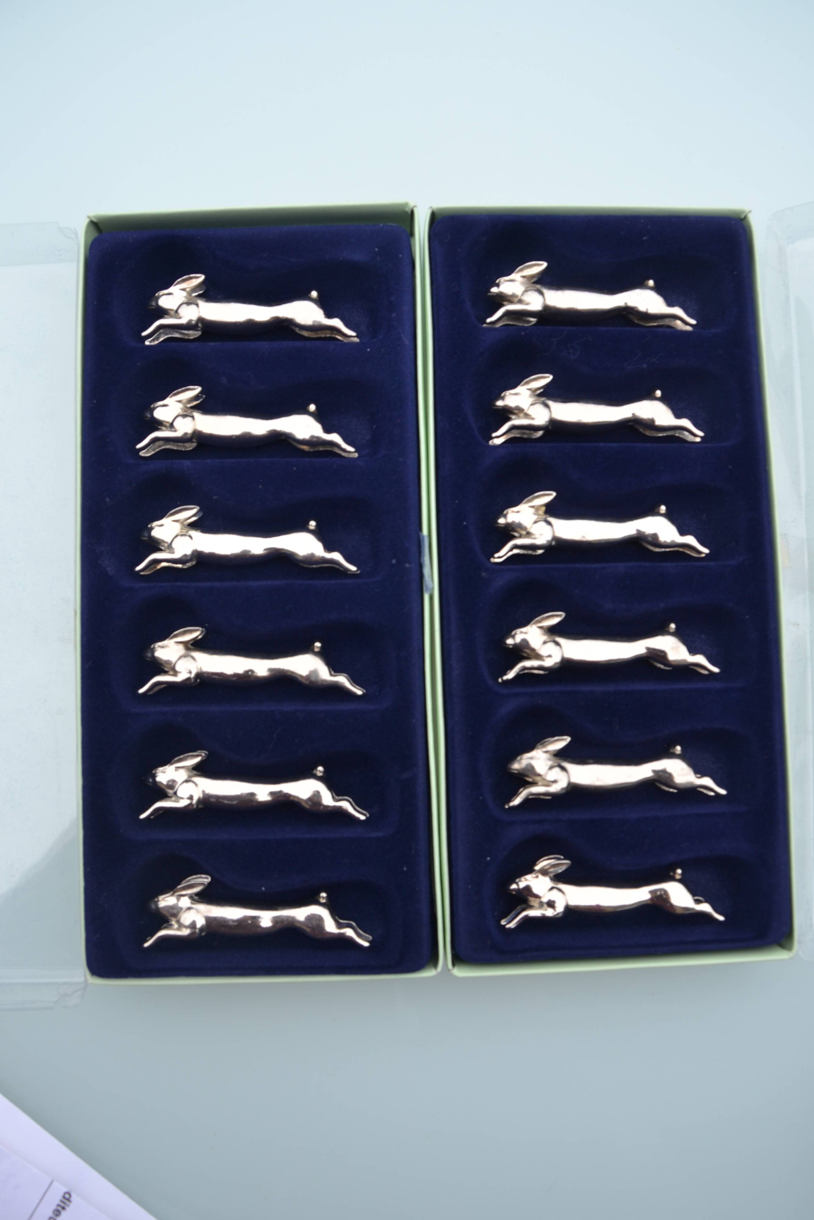 12 silver-plated metal "rabbit" knife rests