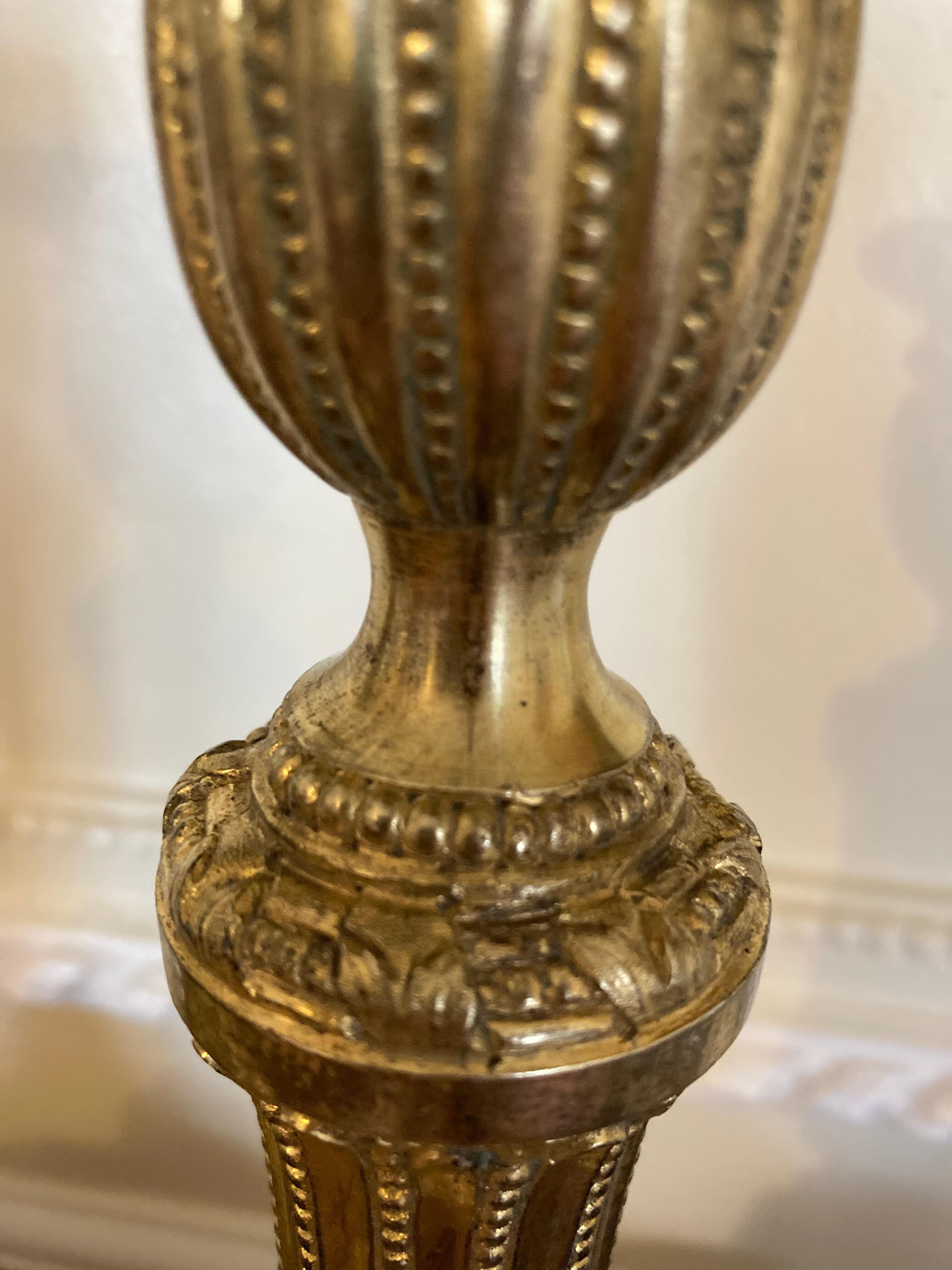 Pair of Louis XVI torch candlesticks in gilded bronze