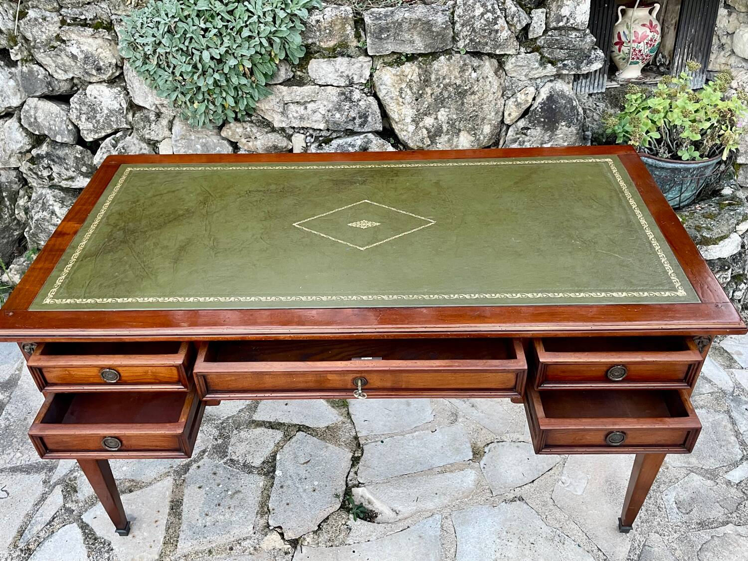 Elegant Louis XVI style mahogany flat desk from the 20th century