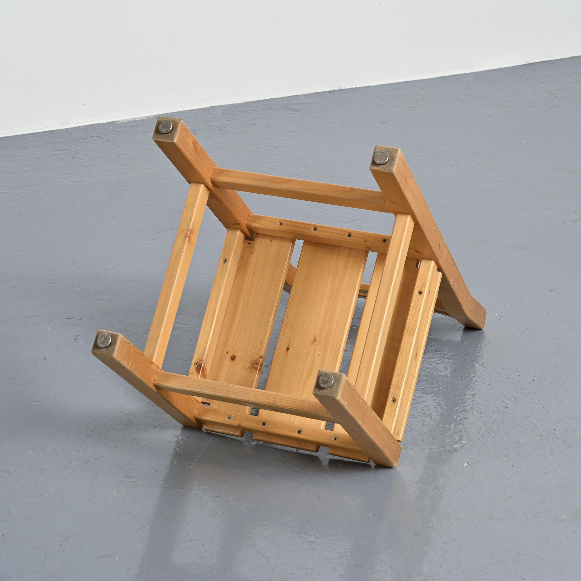 Set of four solid pine chairs by Maison Regain.