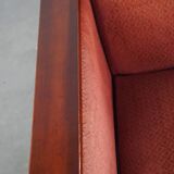 Art Deco design armchair with red fabric upholstery and wooden details